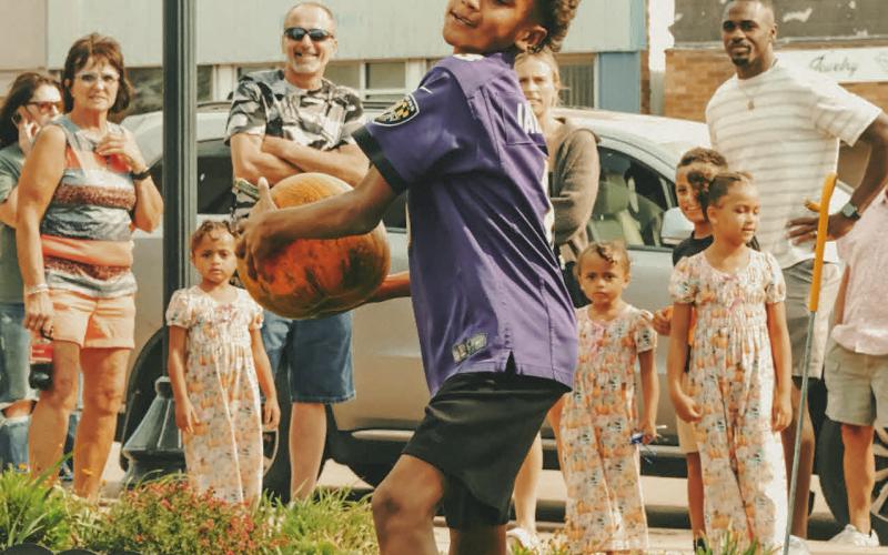 Riley Young, age 10, competes in a pumpkin ‘chunkin’ contest to see who could throw the gourds the furthest distance during Pumpkin Fest in Webster Oct. 4. Young is the son of Karrie and Martevious Young of Sioux Falls. See more on 11. Reporter &amp;amp; Farmer | Leyton Beardslee
