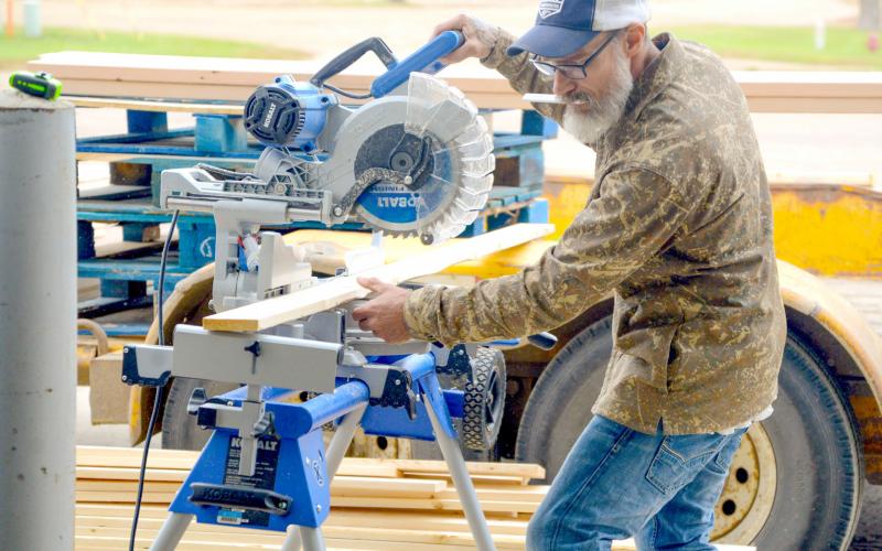 Shawn Andres is a newcomer the Sleep in Heavenly Peace Sisseton chapter who was on scene at Waubay last weekend for a bed build event. Here, he helps measure and cut 2x4s for the other volunteers to use to start building beds. Reporter &amp;amp; Farmer | Connor Handrahan