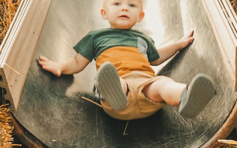 Fisher Kimble, age one, rides down a slide during Pumpkin Fest in Webster Oct. 4. He is the son of Huxley and Kali Kimbol from Watertown. Reporter &amp;amp; Farmer | Leyton Beardslee