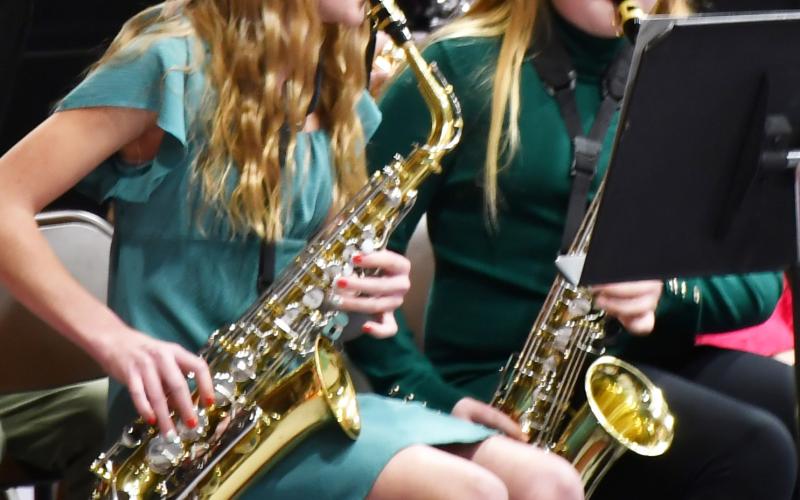 As a part of the sixth grade band’s performance in the winter concert Dec. 9 a multitude of musical presentations were on display. From left Portlyn Johnson and Karley Lone play the saxophone during the concert. Reporter &amp;amp; Farmer | Brenner Cariveau