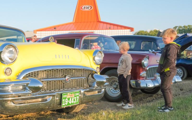 A&amp;amp;W celebration attendees, from left, Grady Tvinnereim, age six, son of Missy Rumpza and Derek Tvinnereim from Webster, and Hayes Spiering, age six, son of Chris and Sarah Spiering of Webster, look at a 1955 Buick during a car show celebrating the A&amp;amp;W restaurant in Webster Sept. 3. Plans were announced earlier this year for the building to be replaced with an updated A&amp;amp;W restaurant. Reporter &amp;amp; Farmer | Leyton Beardslee