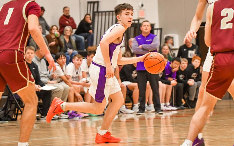 Zayne Strang of Waubay/Summit Mustangs evades defenders during the Mustangs 40-38 victory over Milbank Bulldogs Jan. 20 in Summit. The win ended a four game losing streak for Waubay/Summit who now hold a record of 4-5. Reporter &amp;amp; Farmer | Leyton Beardslee