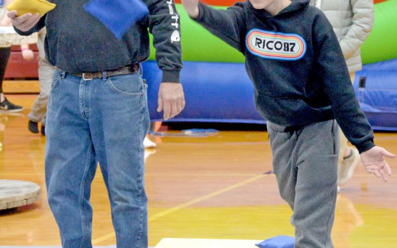 Participating in the Shake Your Shamrock cornhole tournament March 15 at the Webster Armory are Toni Brown and Oakly Ascher. The event was held as a fundraiser for the Webster-Dewangen German student exchange group. Reporter &amp;amp; Farmer | Amanda Dulitz