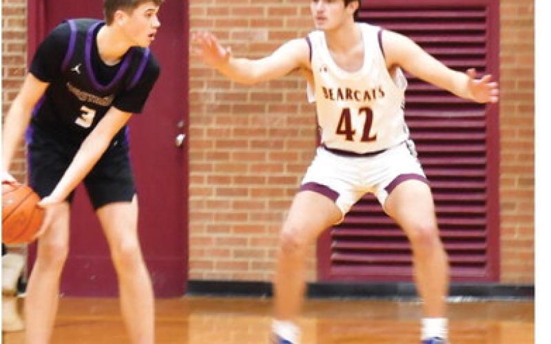 Waubay-Summit Mustangs faced off against the Webster Area Bearcats Dec. 17. Mustangs won the game 45-44. Here, Waubay-Summit guard/forward Hogan Hlavacek (3) assesses the Webster Area defense as Webster Area forward Jack Shoemaker (42) keeps applying pressure. Reporter &amp;amp; Farmer | Brenner Cariveau