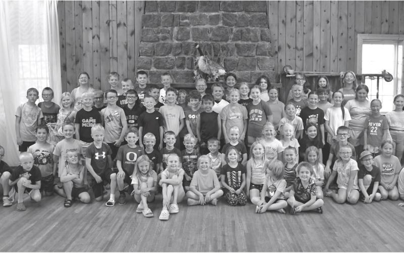 Webster Public Library’s summer reading program party attendees pose for a picture at Izaak Walton in Webster June 30. Sitting in front row from left are Harlyn Deutsch, Amelia Keintz, Aubree Kwasniewski, Huntley Aadland, Berkley Matthews, Jadyn Campbell, Laynie Bjerke, Isaiah Campbell, Arabella Ewing, Beatrix Howe, Leo Siemonsma, Harlow Heupel, Leah Waldner and Ally Moos. Kneeling from left are Rhett Kuecker, Kohenn Konradi, Tyler Acree, Morgan Snaza, River Marko, Audie Kuecker, Harrison Fosheim, Nixon Deu