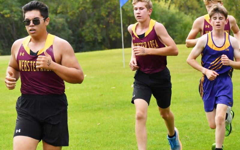 Webster Area Beacats hosted their first home cross country meet of the season at Webster Golf Course Sept. 17. Here, Bearcat runner Justin Ponce leads the pack with fellow Bearcats Gabriel Gaikowski and just behind him is Alec Garrett. Reporter &amp;amp; Farmer | Brenner Cariveau