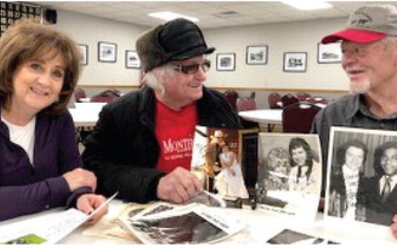 From left, Pam Linton and Sherwin Linton visited with Roger Johanning at Waubay Senior Citizens Center in December. The Lintons donated autographed photos to benefit Alex Jorgenson. Sherwin Linton, orginally from Volga, his wife Pam and band the Cotton Kings have entertained nationwide for many years. Reporter &amp;amp; Farmer | Waubay Clipper photo