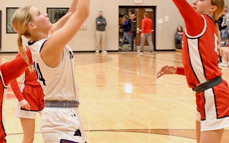 Waubay/Summit Mustangs girls basketball team played host to the Estelline/Hendricks Redhawks Feb. 11 in Summit. Here, player 14 Kayce Berger goes up for a basket. The Mustangs galloped away with the win over the Redhawks, going 13-7, 28-16, 28-41 and 55-41 in the final. Stats of the game were not provided to this publication by deadline. Reporter &amp;amp; Farmer | Robert Dulitz