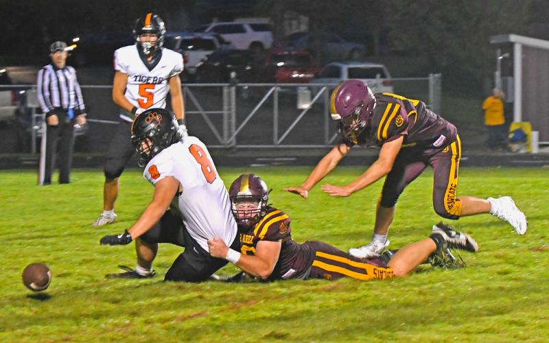 Matthew Mount (52) of Webster Area forces a fumble as he brings down Mobridge-Pollock Tigers running back Tyler Schmeichel (8) during the Bearcat’s 0-50 loss Sept. 19 in Webster. Statistics for the game were not provided in time for publishing. Reporter &amp;amp; Farmer | Amanda Dulitz