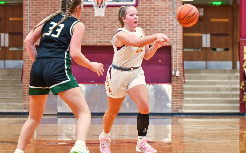 Bailee Ninke (22) of Webster Area dishes out a pass during the Bearcats 34-58 loss to Clark/Willow Lake Jan. 10 in Webster. Ninke finished with a team high 16 points and nine rebounds. Reporter &amp;amp; Farmer | Leyton Beardslee