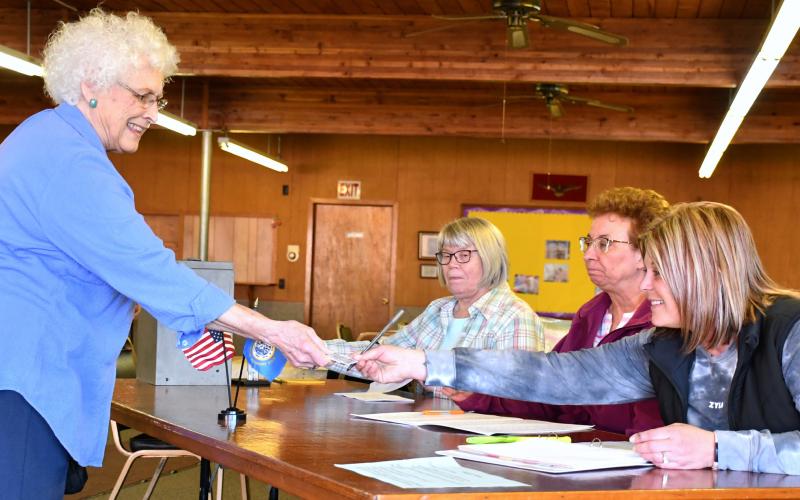 Linda Witt was the final person to cast a ballot at the Bristol Community Center April 9 before the polls closed during the special Groton Area School District election. Here poll workers, Kathryn Bury, Kris Hubsch and Sara Johnson check Witt in and hand her a ballot to cast a vote for or against the opt-out. At the end of the day, the opt-out passed 567 to 275. There was a 33 percent district voter turnout with 842 of 2,572 voters turning out. Reporter &amp;amp; Farmer | Amanda Dulitz