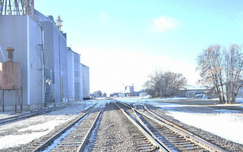 A pigeon flies over the frigid train tracks on E. 4th St. as a cold front prepares to hit Day County in the coming days.