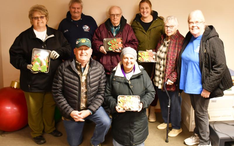 Christmas cookies were donated to local veterans Dec. 18. Pictured from back left, Jill Gaikowski, Doug VanHoudt, Wayne Klungseth, Jenna Wik, Gail Torrence and Winnie Jacobs; in front from left Kevin Bohn and Mary Bloom. Reporter &amp;amp; Farmer | Brenner Cariveau