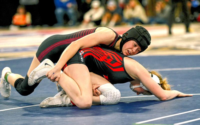 Macee McGregor of Webster Area attempts to pin Chole Caton of Yankton Gazelles during their match in the SDHSAA Girls State Championships Feb. 27 in Sioux Falls. McGregor won the match 11-3 by major decision but did not place for the 115 weight class after being eliminated in the following round. Reporter &amp;amp; Farmer | Brianna Jorgenson, Captured Creations Photography