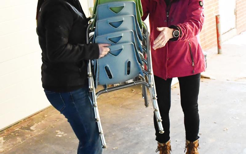 Furniture was being moved from the Knapp &amp;amp; Play Learning Center to the Lake Region Business Center Feb. 21 to make room for renovations. Here from left, Rainy Hanson grabs chairs from Nancy Block as part of the moving process. Reporter &amp;amp; Farmer | Brenner Cariveau
