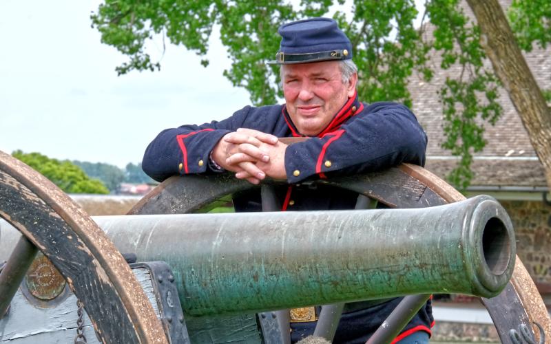 Dave Peterson leans against the wheel of a cannon during Fort Sisseton Historical Festival at Fort Sisseton State Park June 7. According to Peterson he has participated in reenactments and historical festivals for 34 years since 1991. Reporter &amp;amp; Farmer | Leyton Beardslee