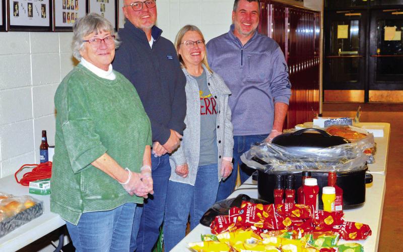 Roslyn Booster Club provided sandwiches, chips and cookies to the community for their appreciation day and Santa meet and greet Dec. 5. From left, Mary Wagner, Ryan Wagner, Shelly Deutsch and Josh Wagner greeted and served guests as they entered the community center. Reporter &amp;amp; Farmer | Connor Handrahan
