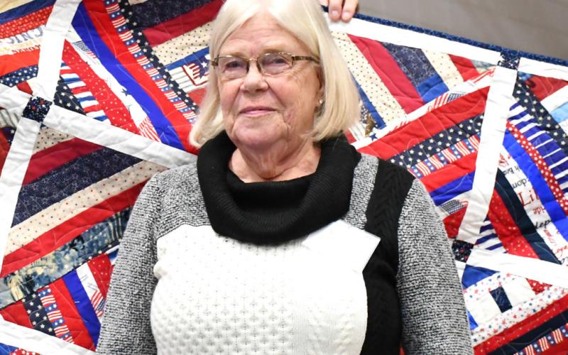 Reporter &amp;amp; Farmer | Leyton Beardslee Winnie Jacobs receives a Quilt of Valor for her late husband William Jacobs during the annual veterans banquet at Webster Armory Nov. 8. William Jacobs served as a Petty Officer in the United States Navy from 197074 and his awards include Combat Action Ribbon, Vietnam Campaign Medal, and the Vietnam Service Medal with Bronze Star.