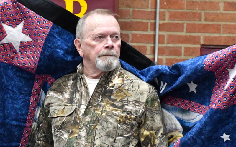 Dale Henrickson receives his Quilt of Valor during the annual veterans banquet at Webster Armory Nov. 8. Henrickson served as a Corporal in the United States Marine Corps from 1969-71 and his awards include Vietnam Combat Medal, and Vietnam Service Medal. Reporter &amp;amp; Farmer | Leyton Beardslee