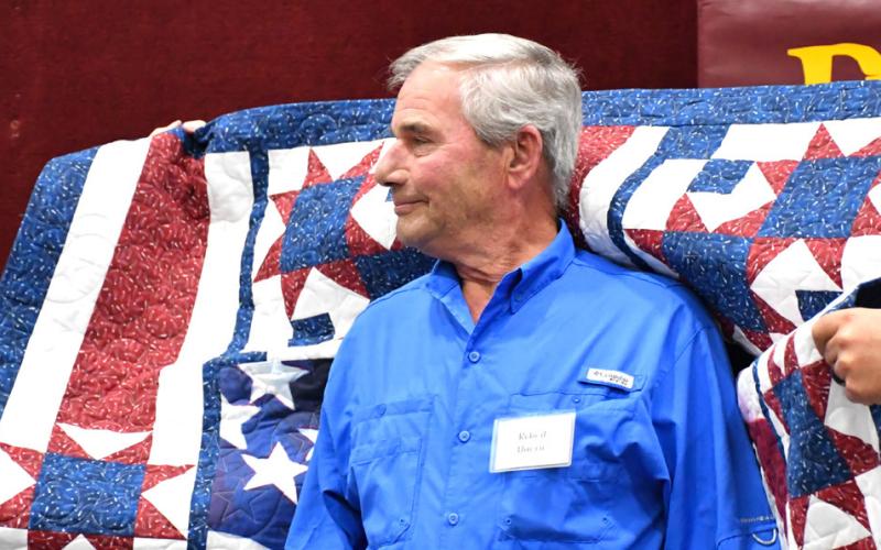 Reporter &amp;amp; Farmer | Leyton Beardslee Robert Duerre receives his Quilt of Valor during the annual veterans banquet at Webster Armory Nov. 8. Duerre served as a Specialist Class 5 in the United States Army from 1968-69 and his awards include four Purple Hearts, Combat Infantry Badge and Vietnam Campaign Medal.