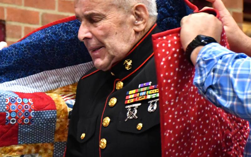 Walter Barr receives his Quilt of Valor during the annual veterans banquet at Webster Armory Nov. 8. Barr served as a Master Sergeant in the United States Marine Corps from 1974-79 and his awards include two Purple Hearts, Vietnamese Cross of Gallantry with gold star, Combat Action Ribbon, and Vietnam Campaign Medal. Reporter &amp;amp; Farmer | Leyton Beardslee