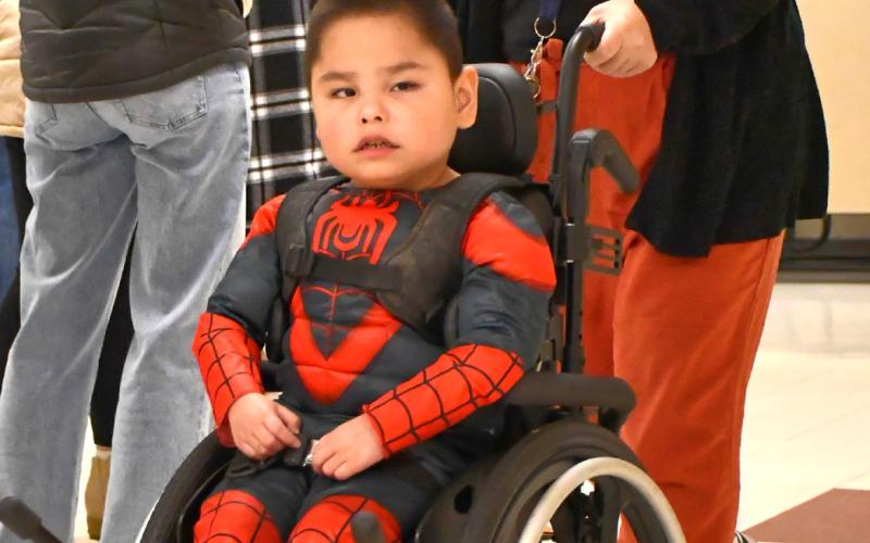 Webster Area first grade student Greyson Brave Bull and paraprofessional Kristen Marko take part in a Halloween costume parade Oct. 31 at Webster Area Elementary. Brave Bull is the son of Chris and Leta Brave Bull. Reporter &amp;amp; Farmer | Leyton Beardslee