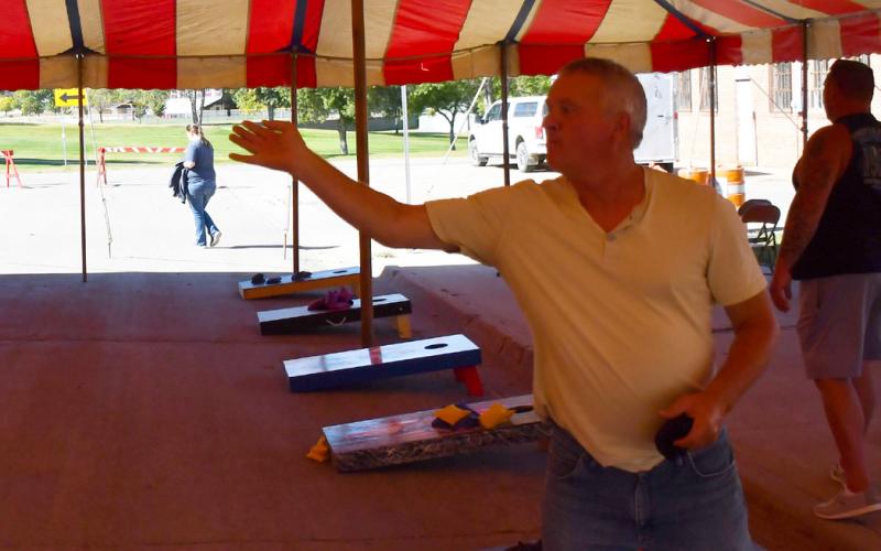 The annual Germanfest was celebrated Sept. 28. One of the many activities during the day was a cornhole tournament which cost $40 per team to register. Here, Rick Guse from Bartonville attempts a tune up shot prior to the tournament’s starting time. Reporter &amp;amp; Farmer | Brenner Cariveau