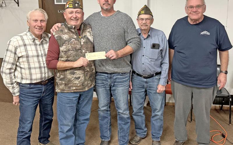 Members of VFW Post 4690 in Webster made a donation to Webster Theatre in order to bring the showing of a free kids movie for area children. The check donation, in the amount of $1,000, was presented Dec. 10. Pictured from left are VFW member Dennis Kurkowski, VFW Commander Kevin Bohn, Webster Theatre owner Shawn Rithmiller, VFW members Wayne Anderson and Tom Lewno. Reporter &amp;amp; Farmer | Subscriber snapshot