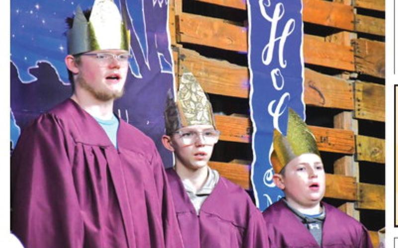From left, Ari Sichmeller, Jack Okroi, and Bryson Bloom represent the wise men and sang during a live reenactment of the holy night Dec. 21. The wise men came to visit Jesus after his birth and brought him presents.