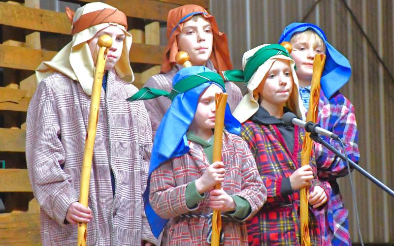 Five shepherds traveled far and wide to witness the birth of Jesus. From back left, Levi Okroi, Ian Mammenga, Barret Bloom; front left, Ollie Siglin and Max Erickson play the shepherds and join the cast in singing worship music for Jesus, Mary and Joseph during a live reenactment Dec. 21. Reporter &amp;amp; Farmer | Connor Handrahan