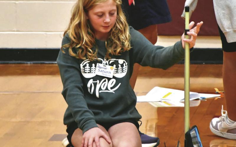 Reporter &amp;amp; Farmer | Leyton Beardslee Webster Area fifth grader Tenlee Wik, daughter of Matt and Jenna Wik, launches an air pressure powered rocket made from a straw Sept. 9. in the Webster Area High School gym. The experiment was part of the weeklong STARBASE program hosted by the school which teaches students about STEM concepts.