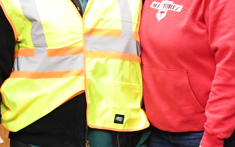 After seeing crossing guard Annette Duarte stand in the cold without a jacket, an anonymous citizen went to Ace Hardware and purchased a jacket on her behalf and requested owner Shannon Garduno to give her the jacket. Here from left, Duarte stands with her new coat next to Garduno. Reporter &amp;amp; Farmer | Brenner Cariveau