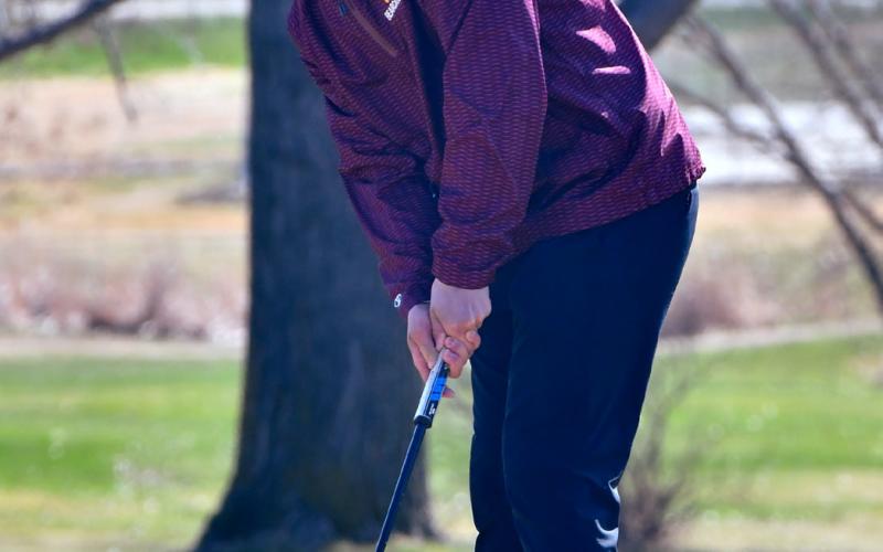 Michael Dorsett watches his putt during the Webster Area Invitational Tournament April 22. Reporter &amp;amp; Farmer | Leyton Beardslee