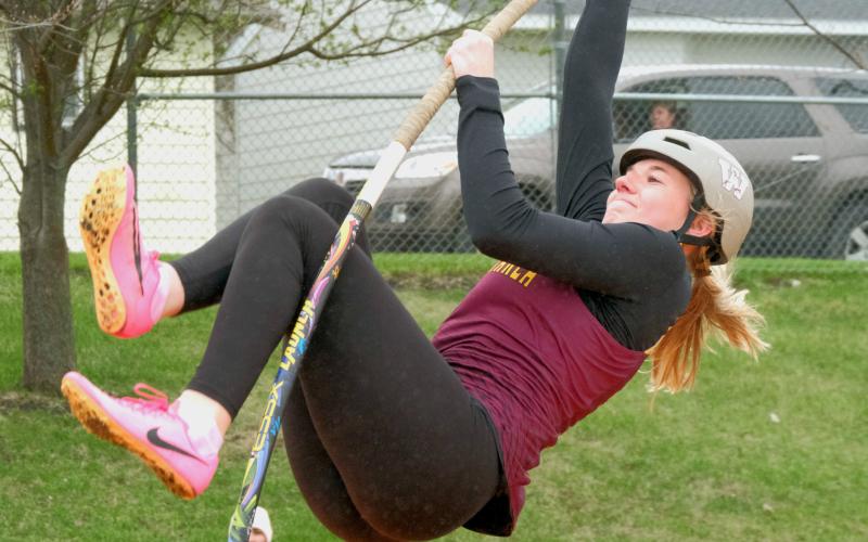 Webster Area High School junior Madison Block eyes the bar during a pole vault attempt at a meet in Webster April 28. Reporter &amp;amp; Farmer | Leyton Beardslee