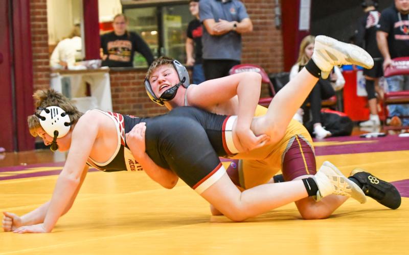 Kane Baumgarn of Webster Area takes down his opponent during a dual meet with Clark/Willow Lake, Kingsbury County and Deuel/Deubrook Area at Webster Armory Jan. 13. Webster Area finished with a 0-3 record for the meet. Reporter &amp;amp; Farmer | Leyton Beardslee
