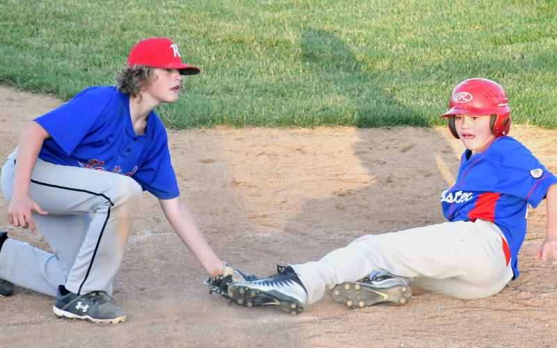 Webster VFW Post 4690 Karstyn Schlechter, right, slides into home June 26 during a home game against the Redfield Flickertails. Reporter &amp;amp; Farmer | Luke Caputo