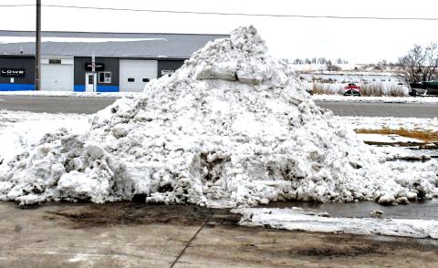Along U.S. Hwy. 12 on the north side of Webster the snow starts to pile up as another snowfall hits Day County. Parking lots and roads were filled with slushy snow April 2 and luckily the snow stopped for a while and people were able to start cleaning up the mess the weather left behind. Reporter &amp; Farmer | Connor Handrahan