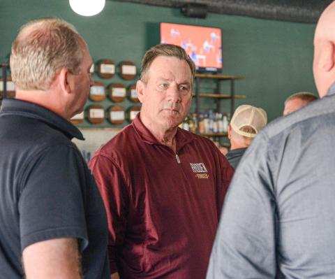 South Dakota sitting governor Larry Rhoden was at a meet and greet event in Webster May 28 ahead of the June 2 primary election. Shown here, he visits with Brett Kwasniewski and Jeremy Lindemann of Lake Region Electric. Reporter &amp; Farmer | Amanda Dulitz