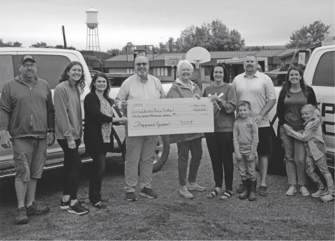 Day County Community Foundation donated $100,000 to Webster Area School's playground equipment project. Pictured from left are Mike Ninke, Emily Wagner, Allegra Duerre, Todd Garry, Rita Johnson. Alyssa and Huck Shoemaker, Craig Case and Natalie and Lucy Kuecker. Reporter &amp; Farmer | Annie Witt