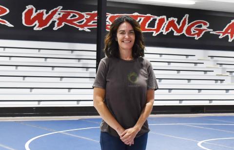 Part owner and founder of Sniper Wrestling Academy Kara Pharis stands in the newly renovated wrestling room which was once the Bristol school gym. Reporter &amp; Farmer | Annie Witt