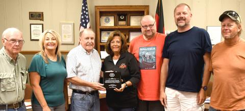 Cindy Hahler was presented an award during Webster City Council’s Aug. 10 regular meeting for her 31 years of dedication to the Webster youth soccer program. Pictured from left are council members Wayne Klungseth, Stacy Mount, Mayor Mike Grosek, Hahler, council members Brian Vogl, Derek Sinner and Toni Brown. Reporter &amp; Farmer | Amanda Dulitz