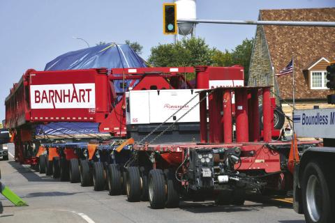 A steam turbine hauled on a trailer by three semi-trucks is pulled down Main St. in Webster Sept. 8. South Dakota Department of Public Safety was unable to release details about the turbine’s exact destination or owner but a pilot vehicle driver confirmed it was going to be heading north to Canada. The rig had an excess of 200 tires. Reporter &amp; Farmer | Leyton Beardslee