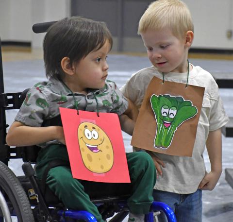 Theodore Rencountre and Grady Olson illustrate the heart of the song “Friends Forever” which was sung at the conclusion of the Waubay Elementary spring concert April 10. Students linked arms in a show of unity. This year’s concert theme was “How Does Your Garden Groove.” Reporter &amp; Farmer | Amanda Dulitz Garden groovers
