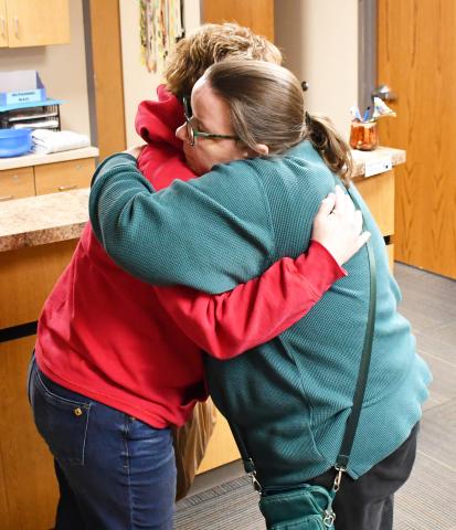 An anonymous citizen purchased a jacket at Ace Hardware Feb. 6 for Webster Area School crossing guard Annette Duarte after they saw her in the cold without the proper attire. Once the jacket was purchased, the good Samaritan asked Ace Hardware owner Shannon Garduno to drop the jacket off at the school for Duarte. Here, Garduno embraces Duarte after the jacket was presented. See more on page 6. Reporter &amp; Farmer | Brenner Cariveau