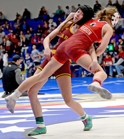 Macee McGregor picks up Sisseton Redmen wrestler Clara Iverson during the Lee Wolf tournament Feb. 1, winning via decision for a fifth place finish in the 120 pound girls division. Reporter &amp; Farmer | Subscriber snapshot
