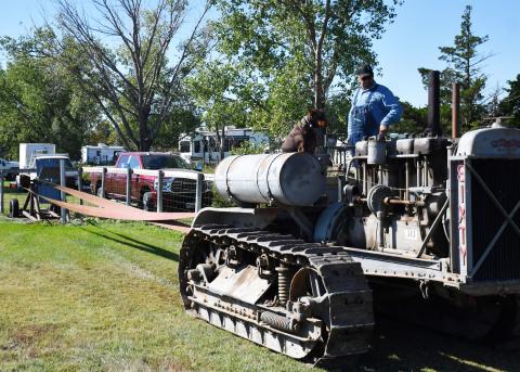 As the James Valley Threshing Show took place in Andover Sept. 6-8, various events occurred including a parade which included old agricultural machines. Here, in preparation of the parade Sept. 7, Justin Cooper and his dog DaZee from Lennox use a Baker fan to get their 1926 Caterpillar Sixty tractor in optimal condition for the parade. Reporter &amp; Farmer | Brenner Cariveau