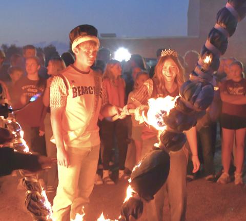 Webster Area School District held their burning of the W celebration during the coronation Sept. 14. Homecoming king, Gage Baumgarn and queen, Chloe Mammenga light the torch to start off the week of celebration. Reporter &amp; Farmer | Connor Handrahan