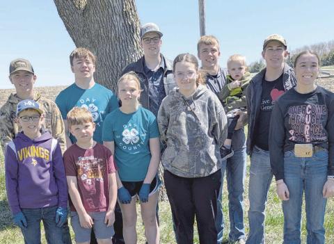 Country Kids 4-H Club completed their yearly community service project at New Sweden Cemetery. They picked up branches before mowing and planting flowers in pots. Pictured from left, front, are Nolan Rasmus, Will Weitbrecht, Morgan Weitbrecht, Lynnea Hubsch, Gabriel Gaikowski, Macee McGregor; back, Dylan Rasmus, Nathan Hubsch, Blaise McGregor and Aiden Gaikowski holding Maverick Thurston. Reporter &amp; Farmer | Subscriber snapshot
