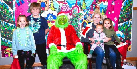 The Grinch and Cindy Lou Who met with families at Waubay Senior Center’s Christmas celebration Dec. 6. Violet, Braxton, Brynleigh and Lesedi Renville talked and joked with The Grinch and Cindy Lou Who. Jokingly, everyone kept their distance from The Grinch, just in case he tried something. Reporter &amp; Farmer | Connor Handrahan