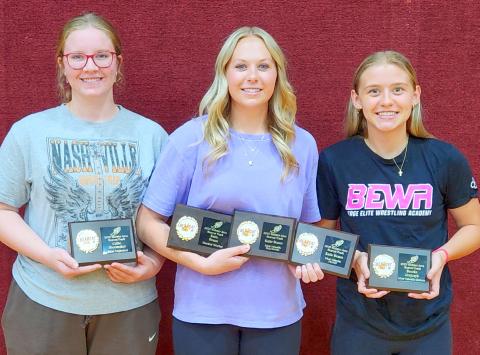 Webster Area girls track and field athletes hold up their end of season awards. From left Callie Shoemaker was awarded most improved, Katie Braun was awarded hardest worker, most valuable field events and the Ashley Charron award for most valuable overall, Brooke Grajczyk was awarded most valuable runner. Reporter &amp; Farmer | subscriber snapshot